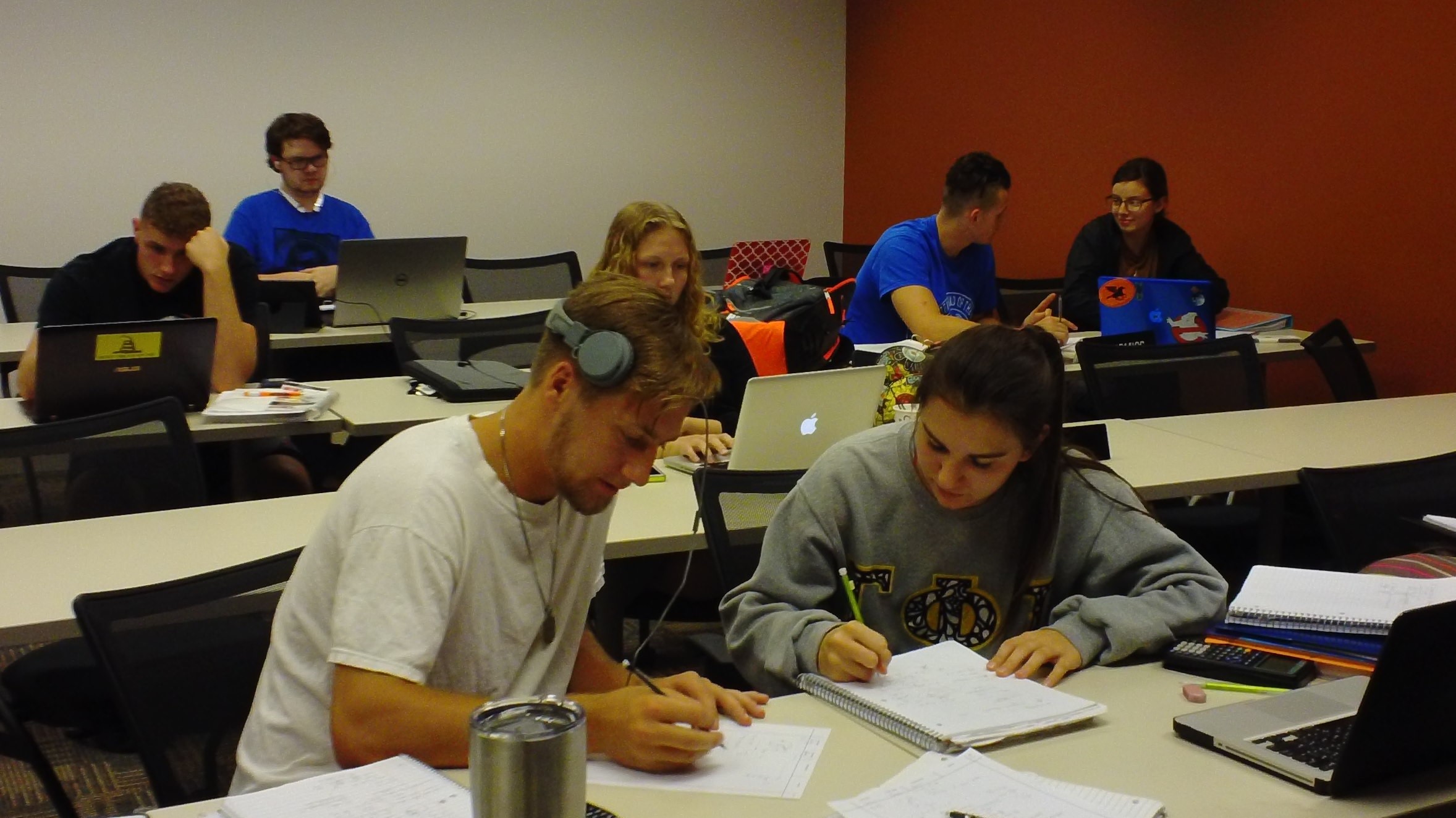 Students In a Library classroom working on a project together.