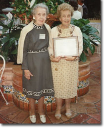 Bernice Dredla Sanderson and Alberta Dredla accepting an award.