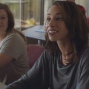 a woman looking excited in a classroom